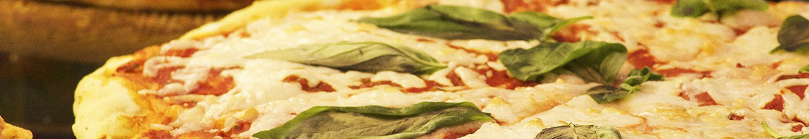 Eating Italian Pizza Sandwich at Famous Restaurant & Baking Company restaurant in New Bern, NC.